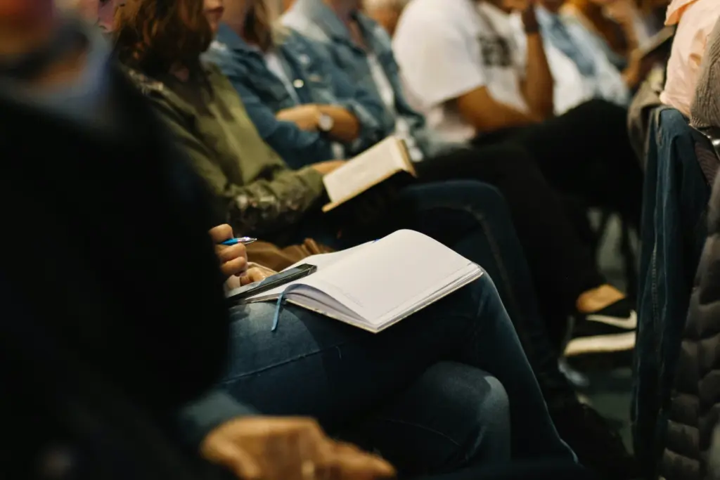 A congregation seated with open Bibles